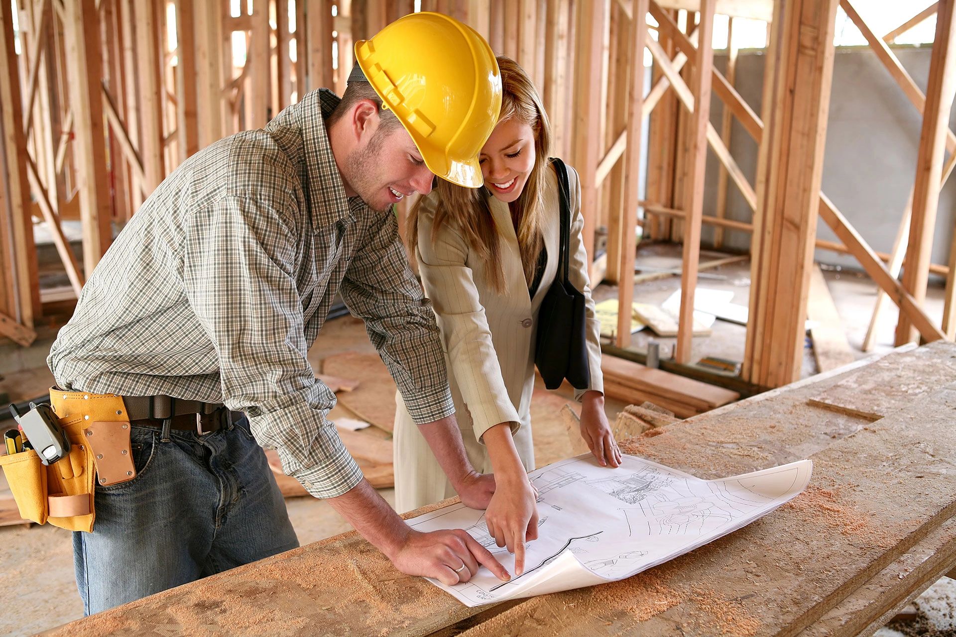 Contractor reviewing blueprints